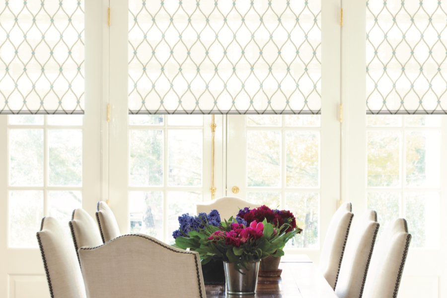 Patterned window shades on dining room windows