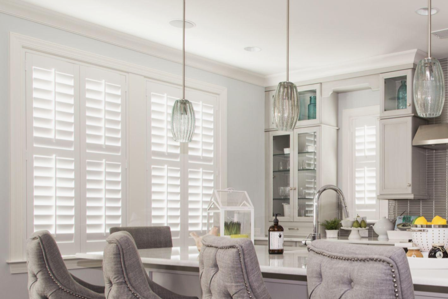 Kitchen cabinets and windows with white plantation shutters